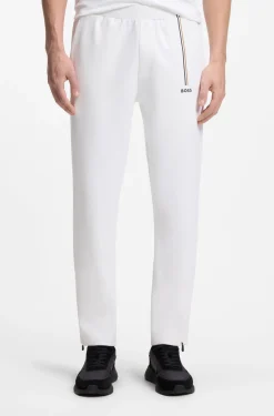 Active tracksuit bottoms in thermoregulating stretch gabardine