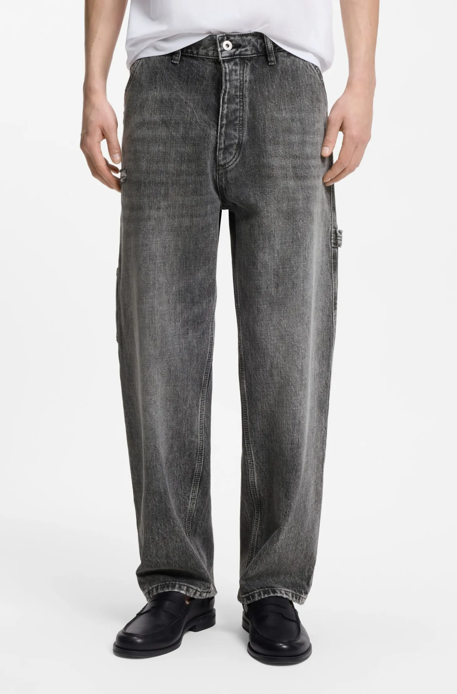 Baggy-fit black jeans with carpenter details