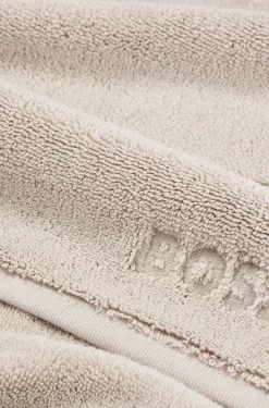 Beige Aegean-cotton bath mat with tonal logo