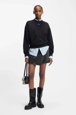 Black-denim skirt with asymmetric waistband