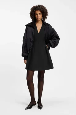 Cap-sleeve dress with pleat details