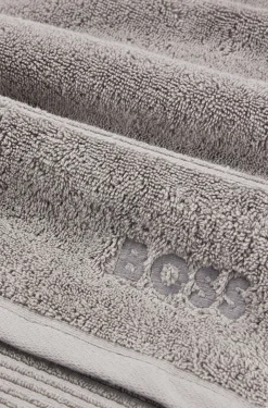 Cotton bath mat in silver with embroidered logo