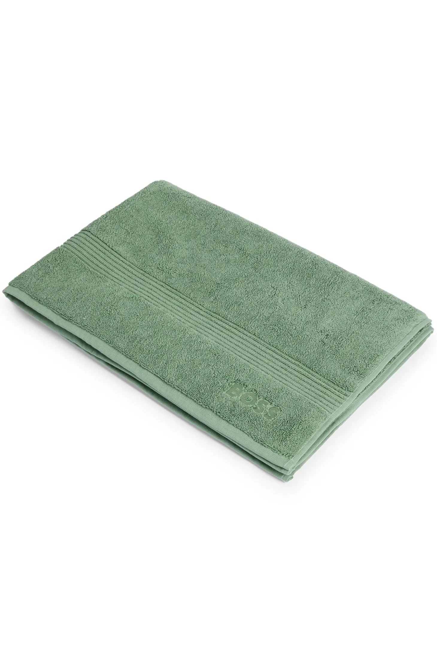 Cotton bath mat with embroidered logo