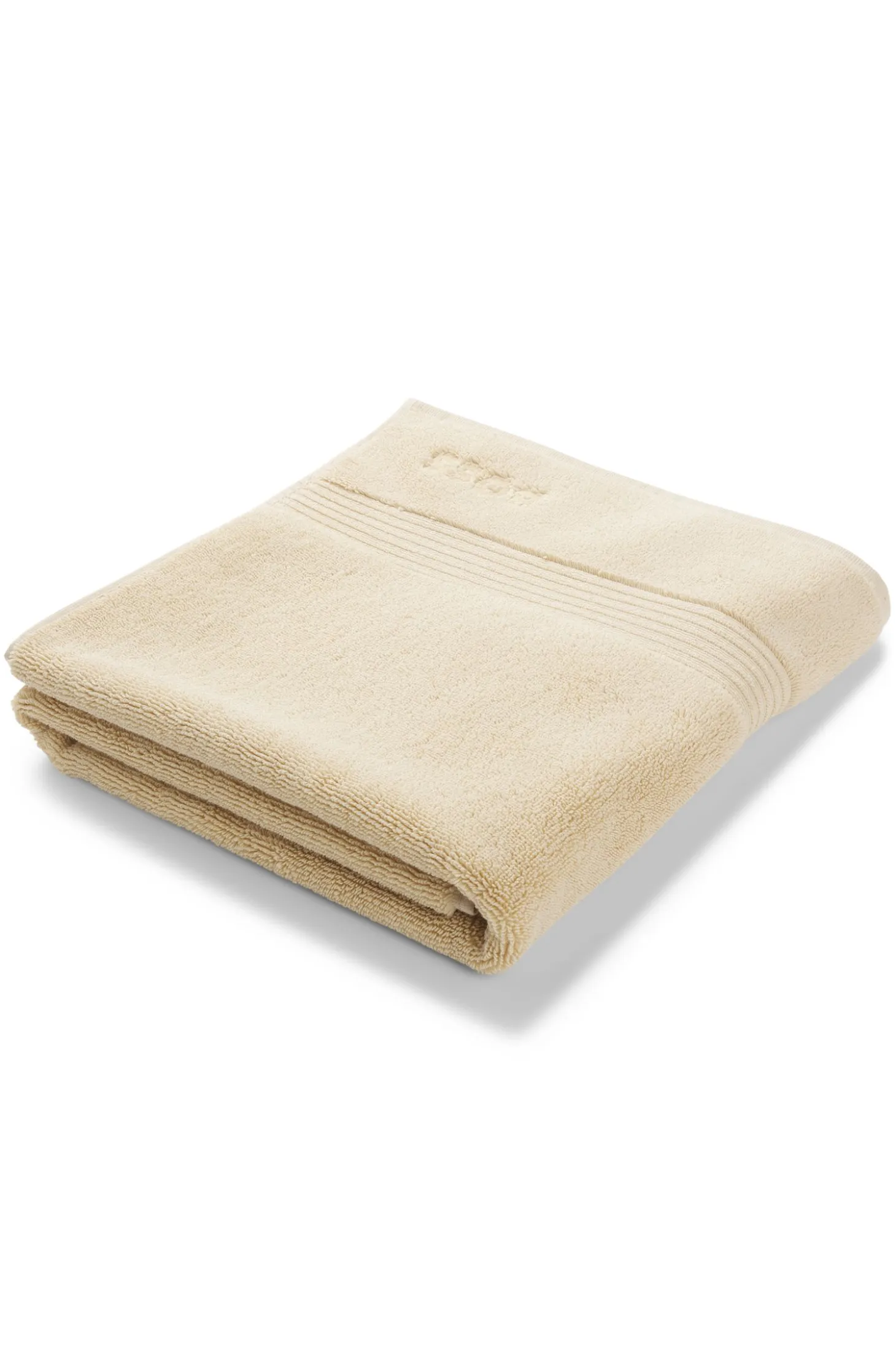 Cotton bath mat with embroidered logo