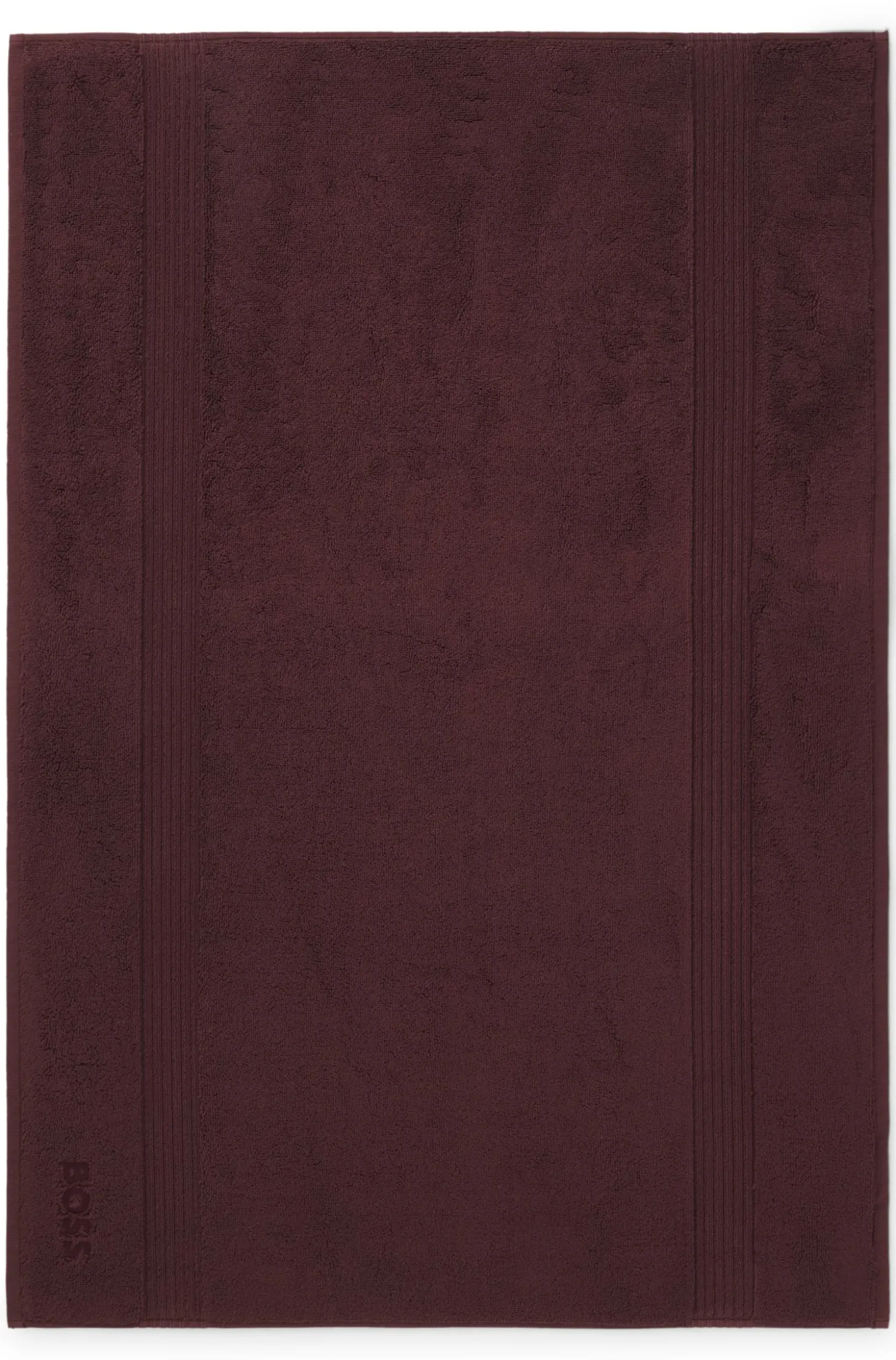 Cotton bath mat with embroidered logo