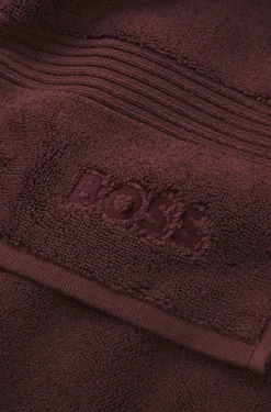 Cotton bath mat with embroidered logo