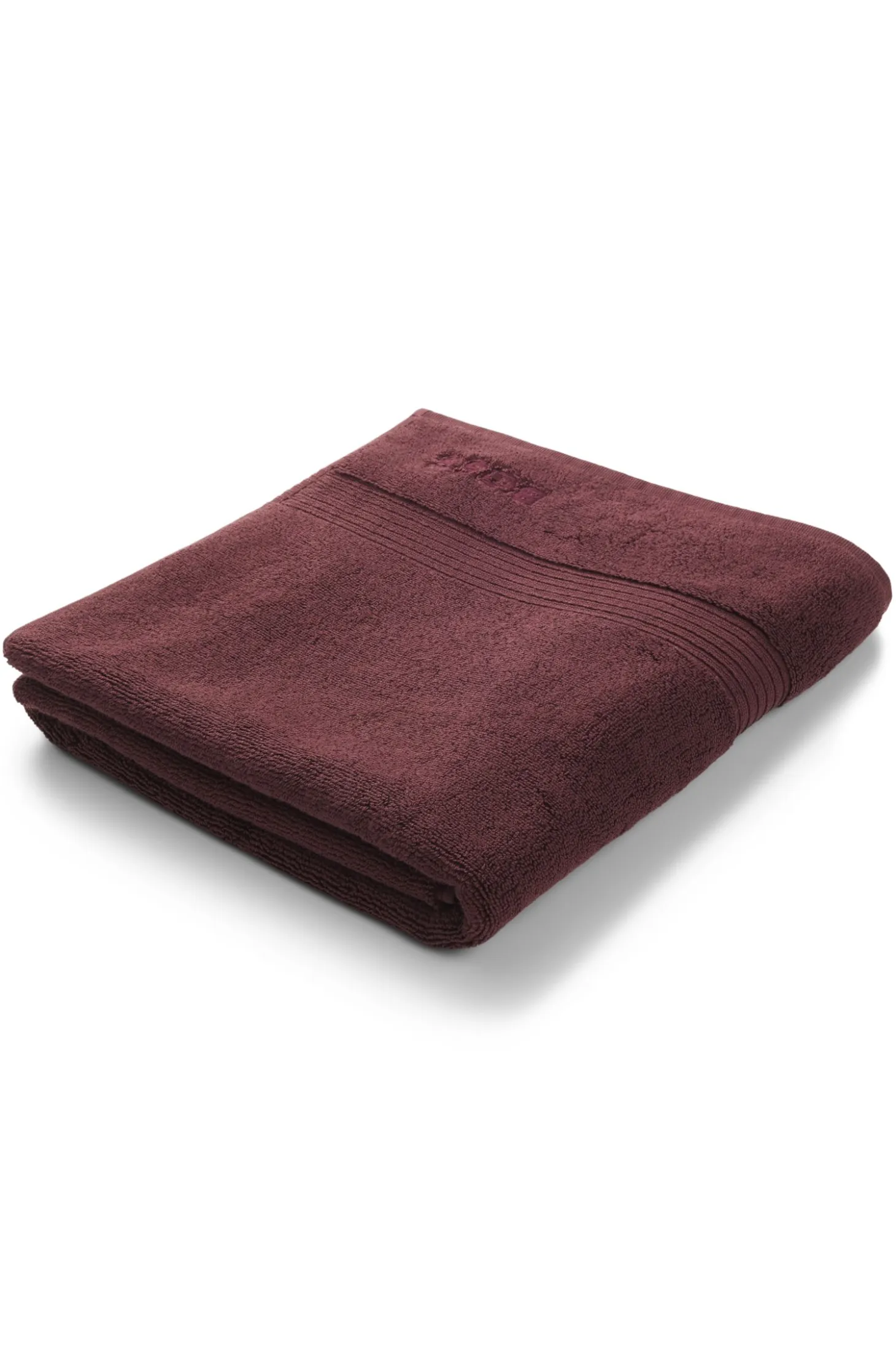 Cotton bath mat with embroidered logo