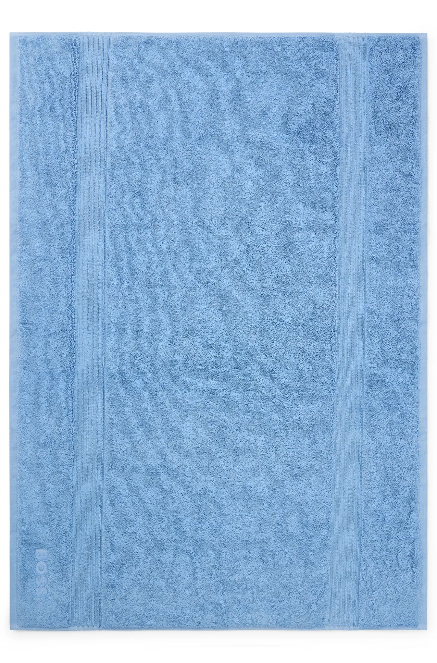 Cotton bath mat with embroidered logo