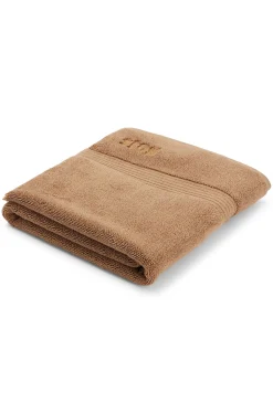 Cotton bath mat with embroidered logo
