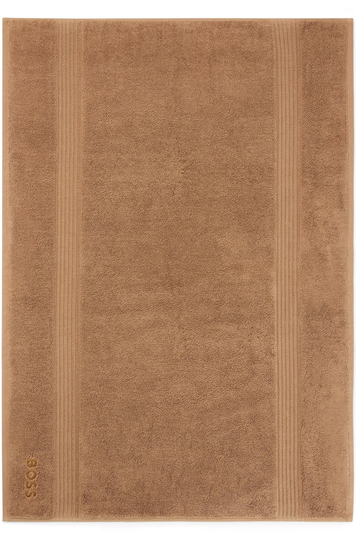 Cotton bath mat with embroidered logo