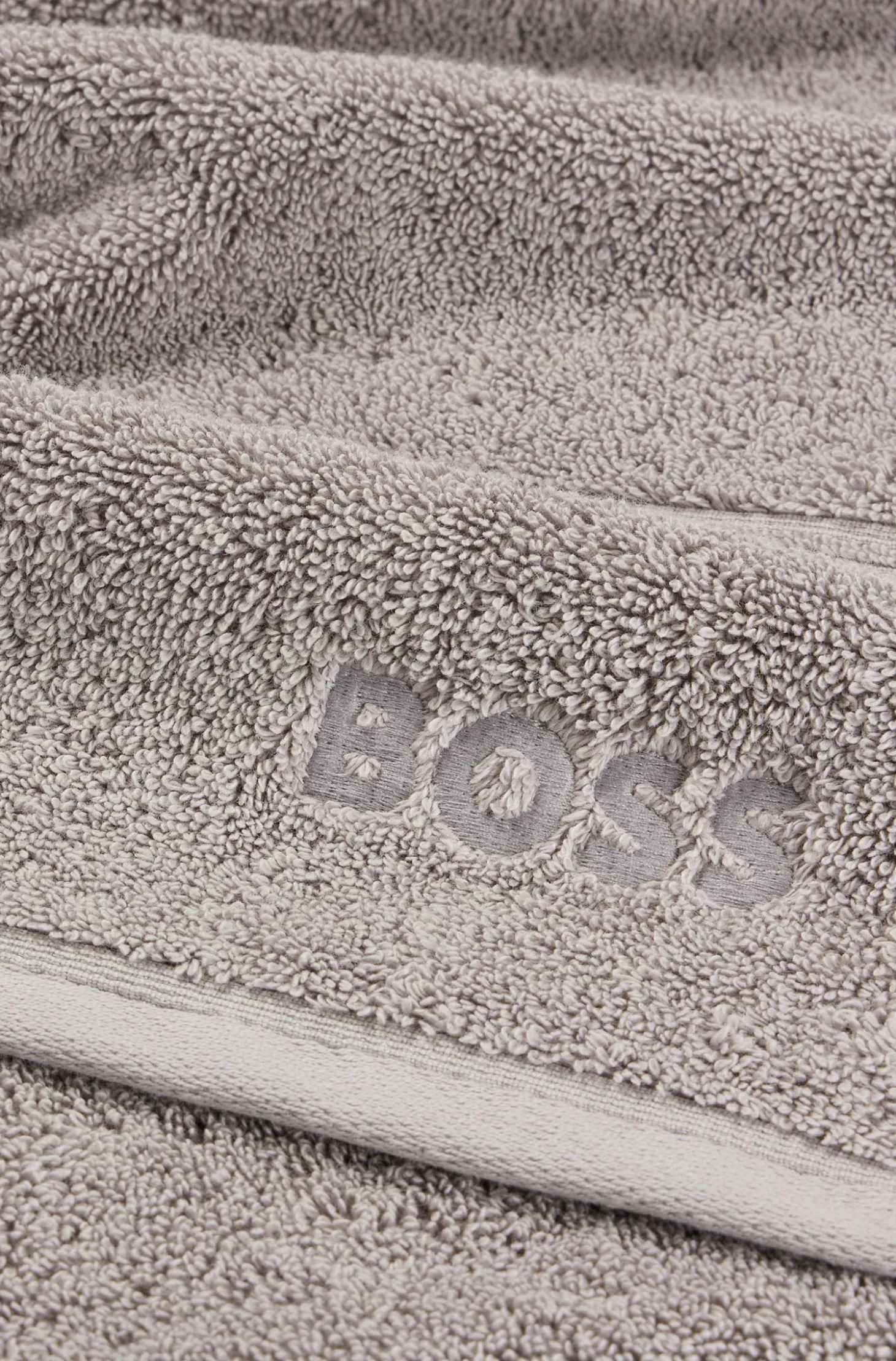 Cotton bath towel in silver with embroidered logo