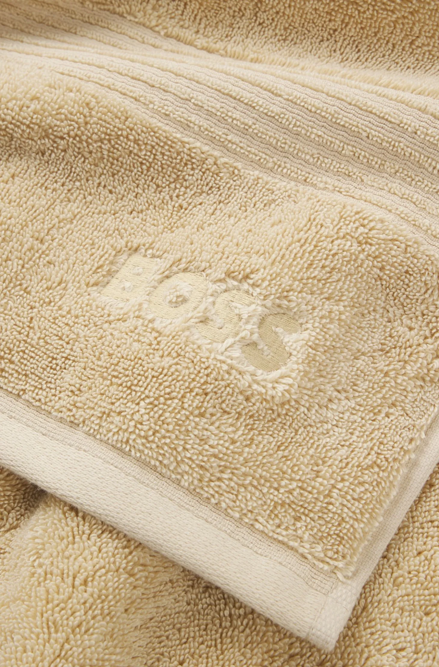 Cotton bath towel with tonal embroidered logo