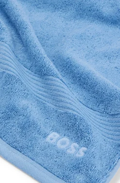 Cotton bath towel with tonal embroidered logo