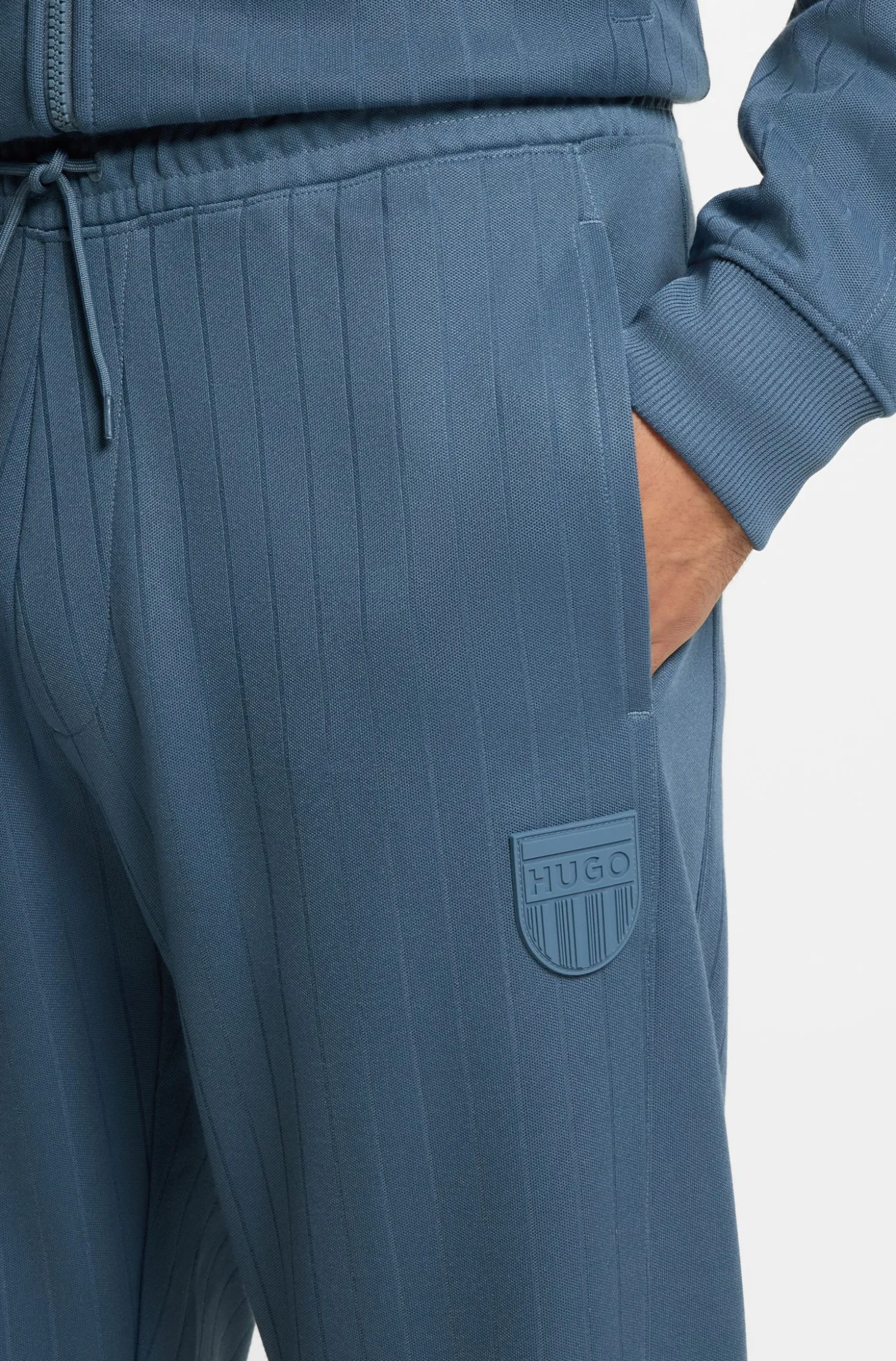 Cotton-blend tracksuit bottoms with drop-needle stripe