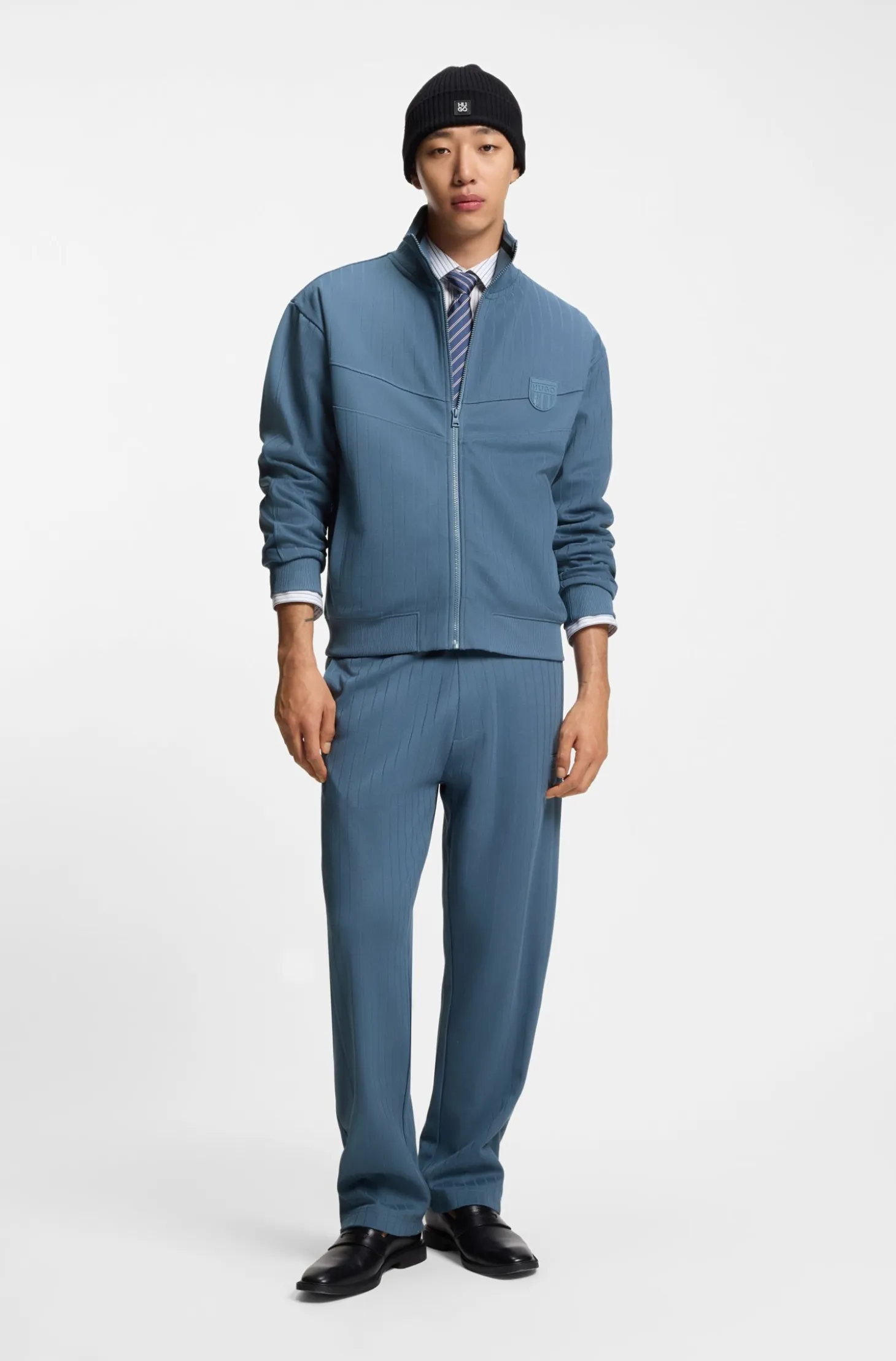 Cotton-blend tracksuit bottoms with drop-needle stripe