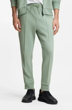 Cotton-blend tracksuit bottoms with piping details