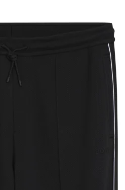 Cotton-blend tracksuit bottoms with piping details