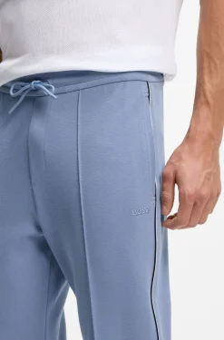 Cotton-blend tracksuit bottoms with piping details