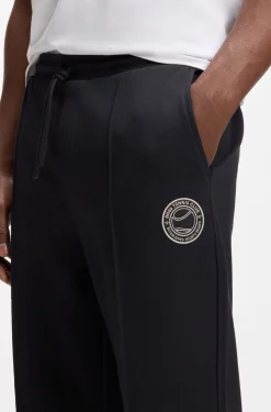 Cotton-blend tracksuit bottoms with tennis-themed logo