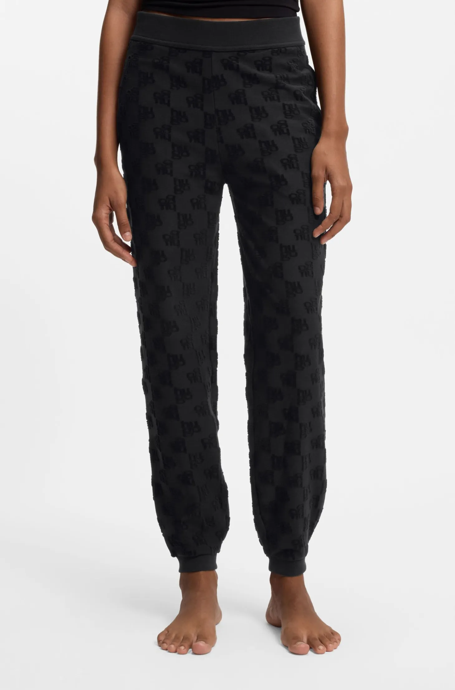 Cotton-blend tracksuit bottoms with all-over logo pattern
