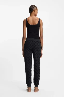 Cotton-blend tracksuit bottoms with all-over logo pattern