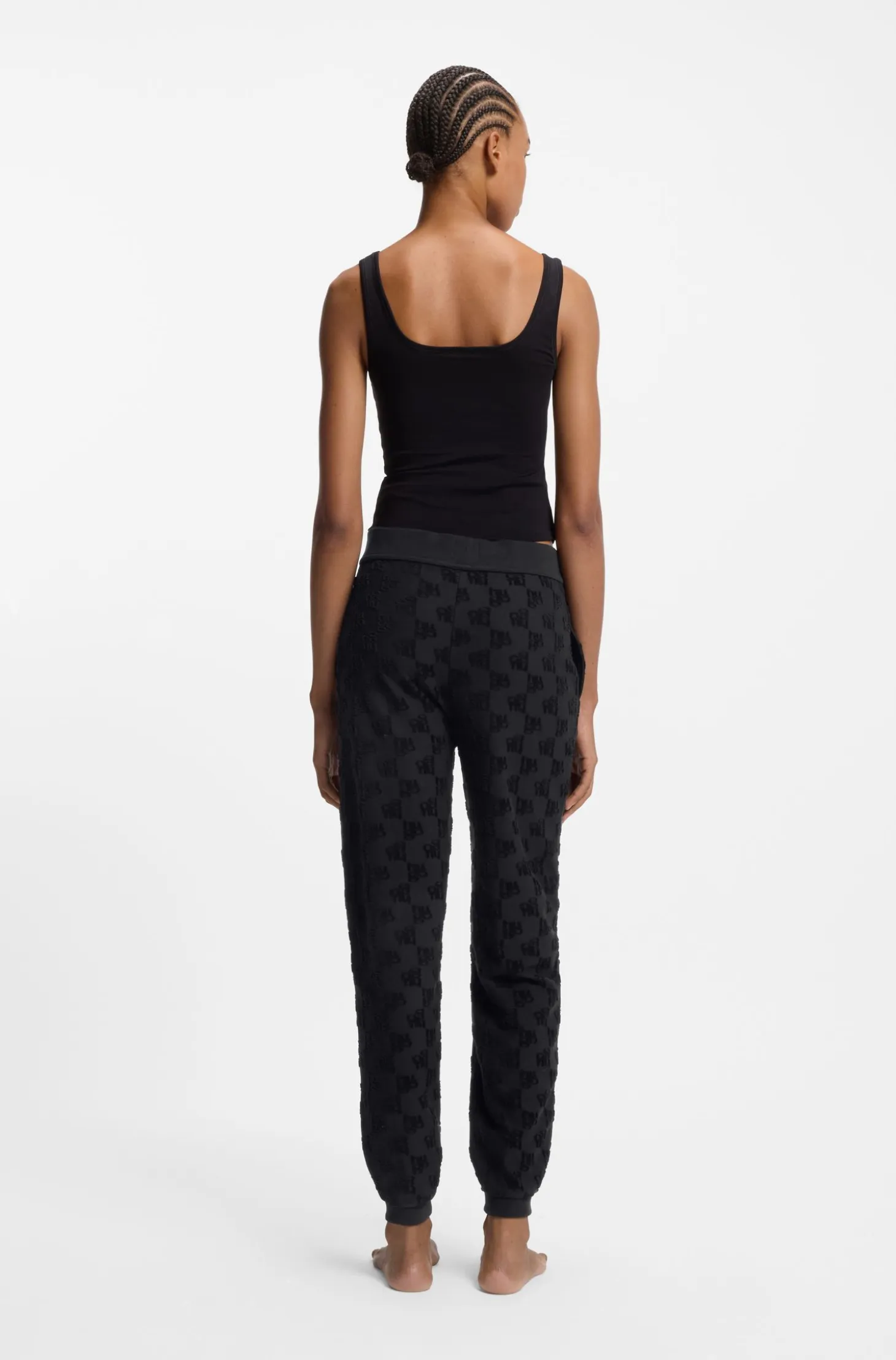 Cotton-blend tracksuit bottoms with all-over logo pattern