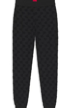 Cotton-blend tracksuit bottoms with all-over logo pattern