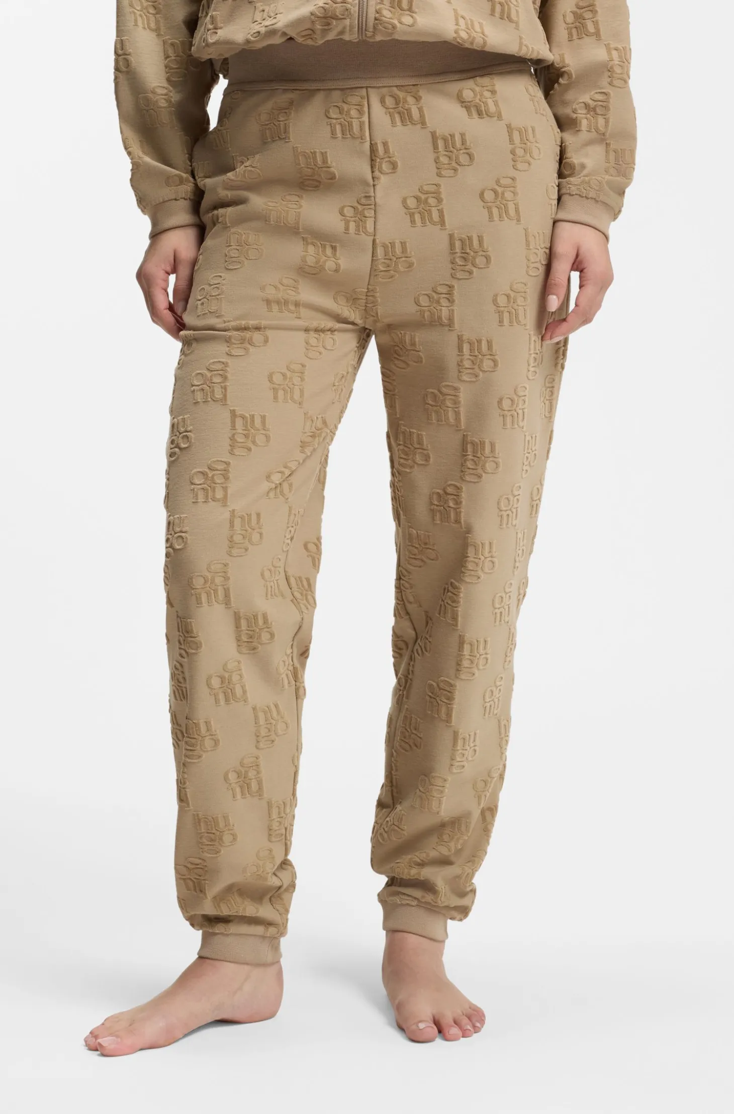 Cotton-blend tracksuit bottoms with all-over logo pattern