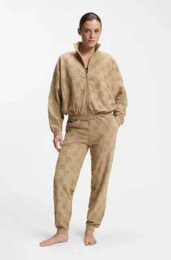 Cotton-blend tracksuit bottoms with all-over logo pattern