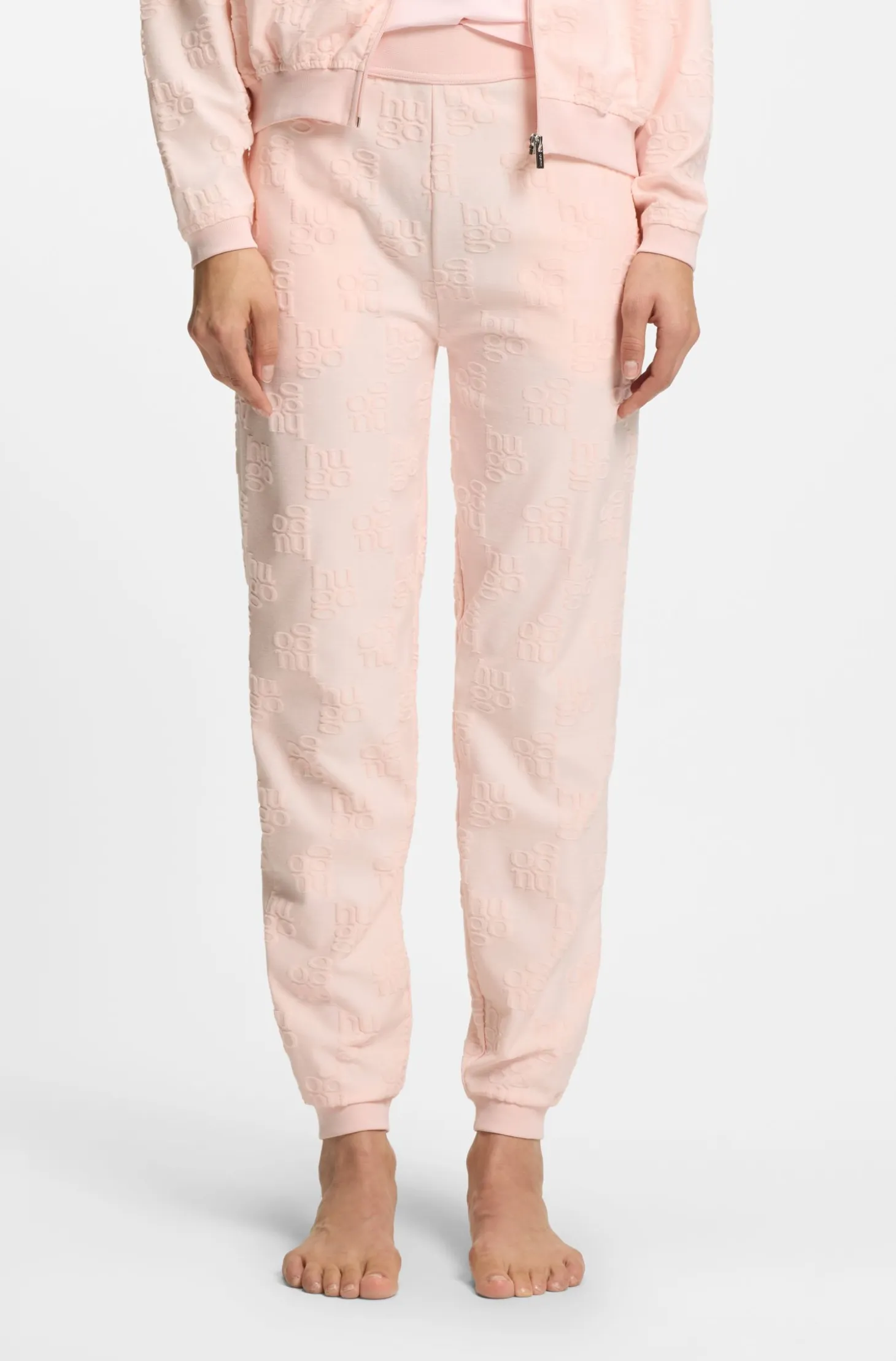Cotton-blend tracksuit bottoms with all-over logo pattern