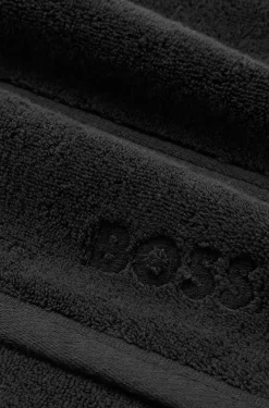 Cotton guest towel in black with embroidered logo