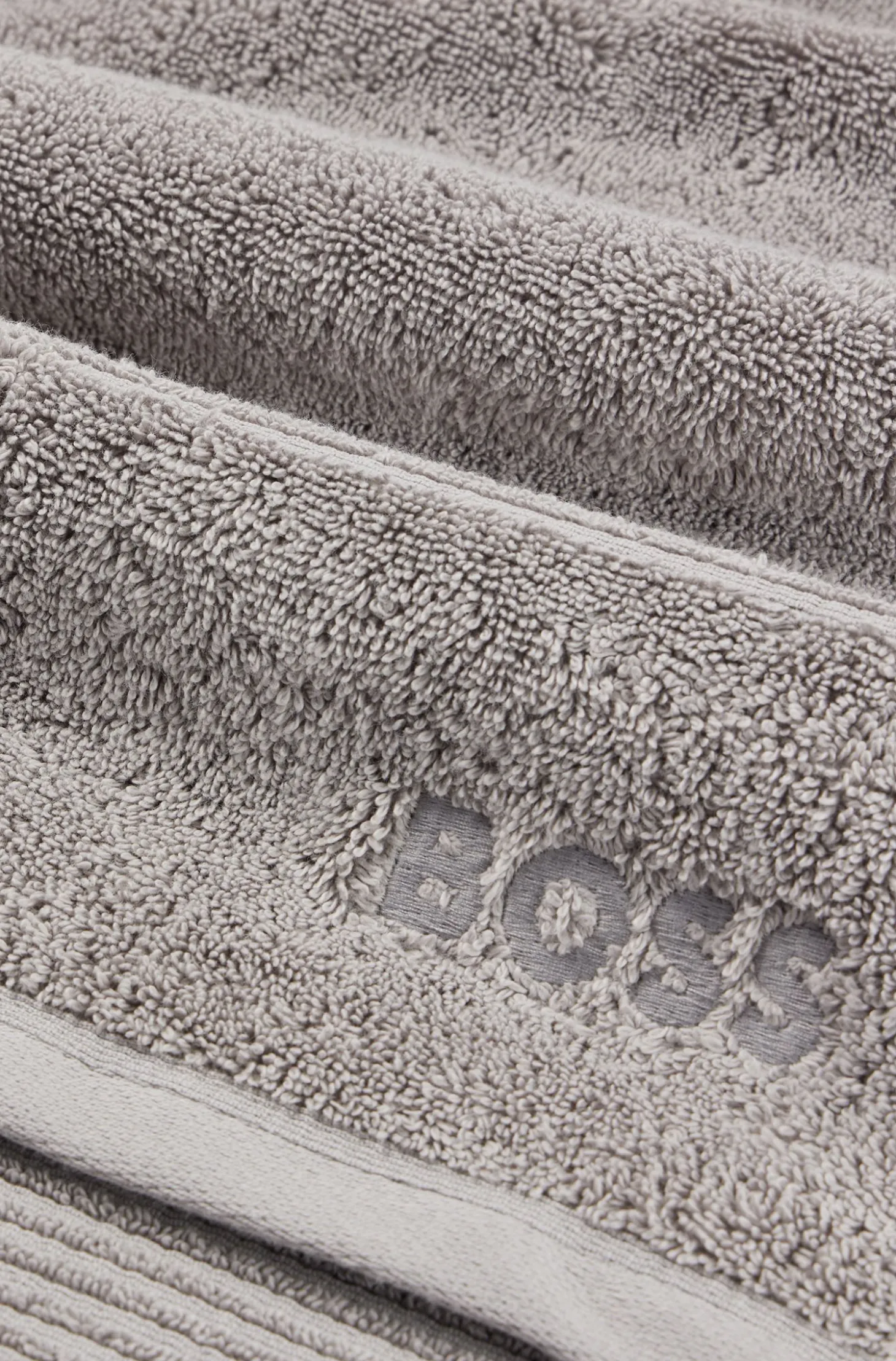 Cotton guest towel in silver with embroidered logo