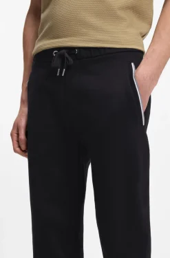 Cotton-terry tracksuit bottoms with signature stripes