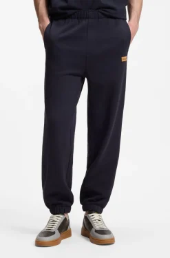 Cotton-terry tracksuit bottoms with logo badge