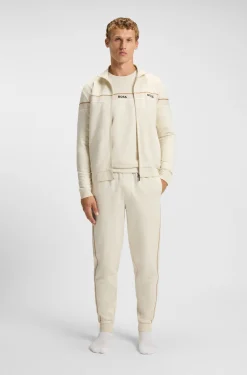 Cotton-terry tracksuit bottoms with tape and logo