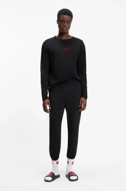 Cuffed loungewear bottoms in stretch cotton with logo print