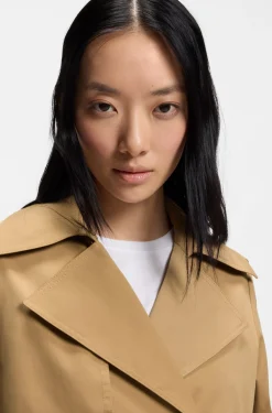 Double-breasted trench coat with buckled belt