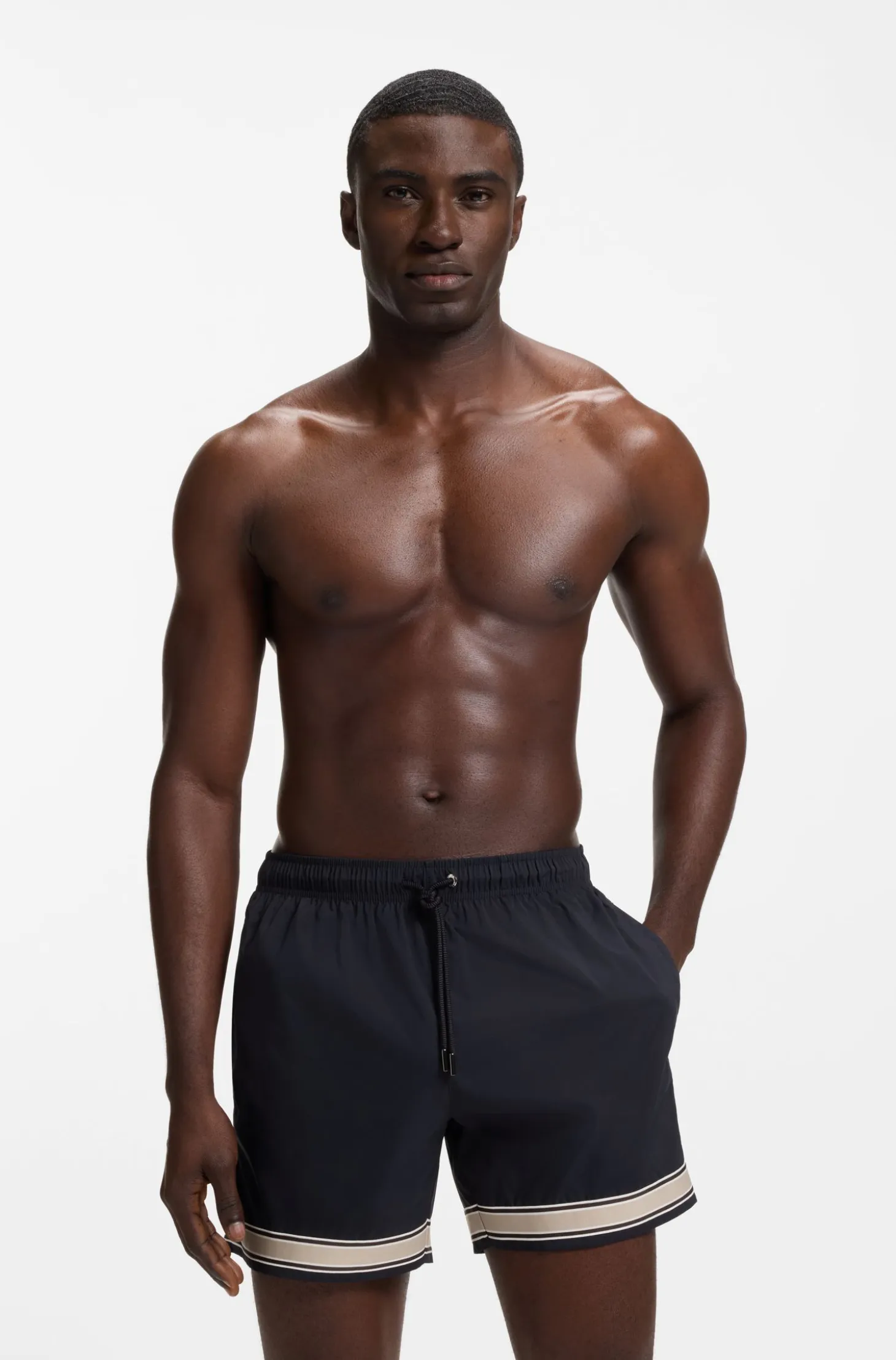 Drawstring swim shorts in stretch fabric with tape trim
