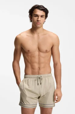 Drawstring swim shorts in stretch fabric with tape trim