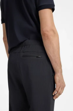 Drawstring trousers in stretch waffle fabric with framed zip