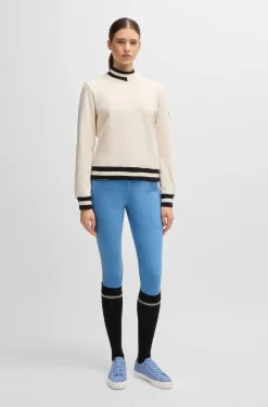 Equestrian knee-grip breeches with four-way stretch
