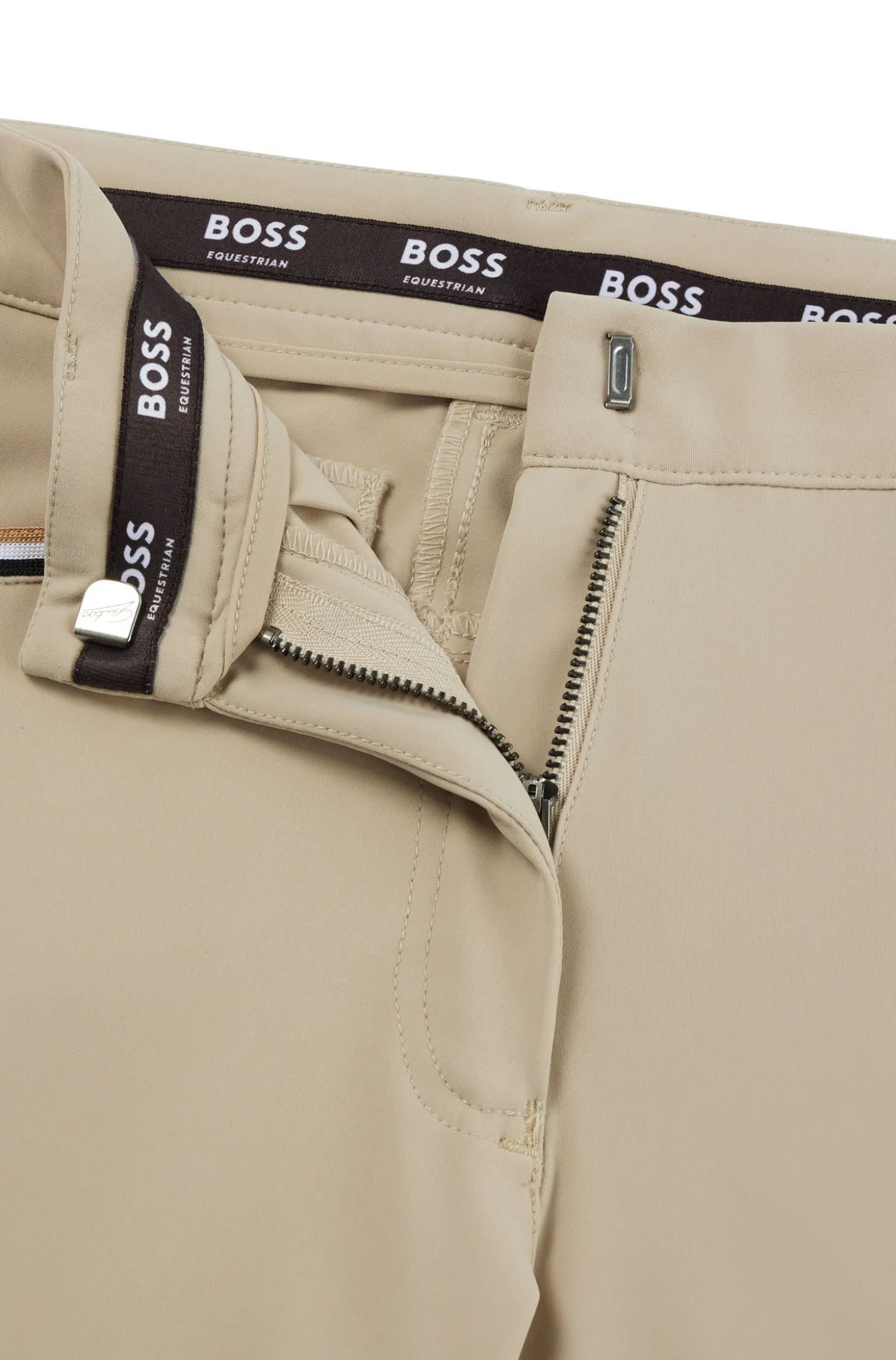 Equestrian knee-grip breeches in power-stretch material