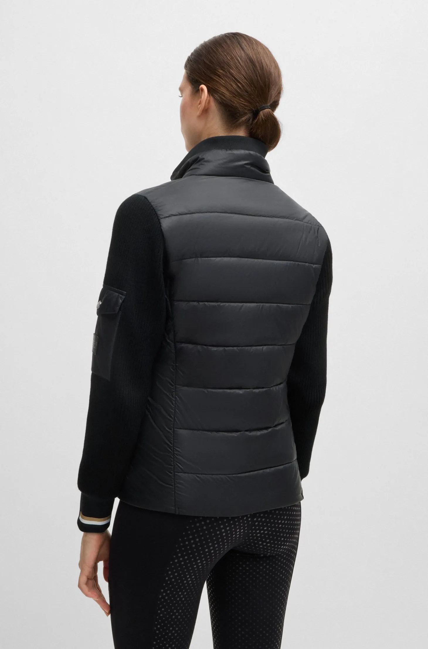 Equestrian mixed-material jacket with sleeve pocket