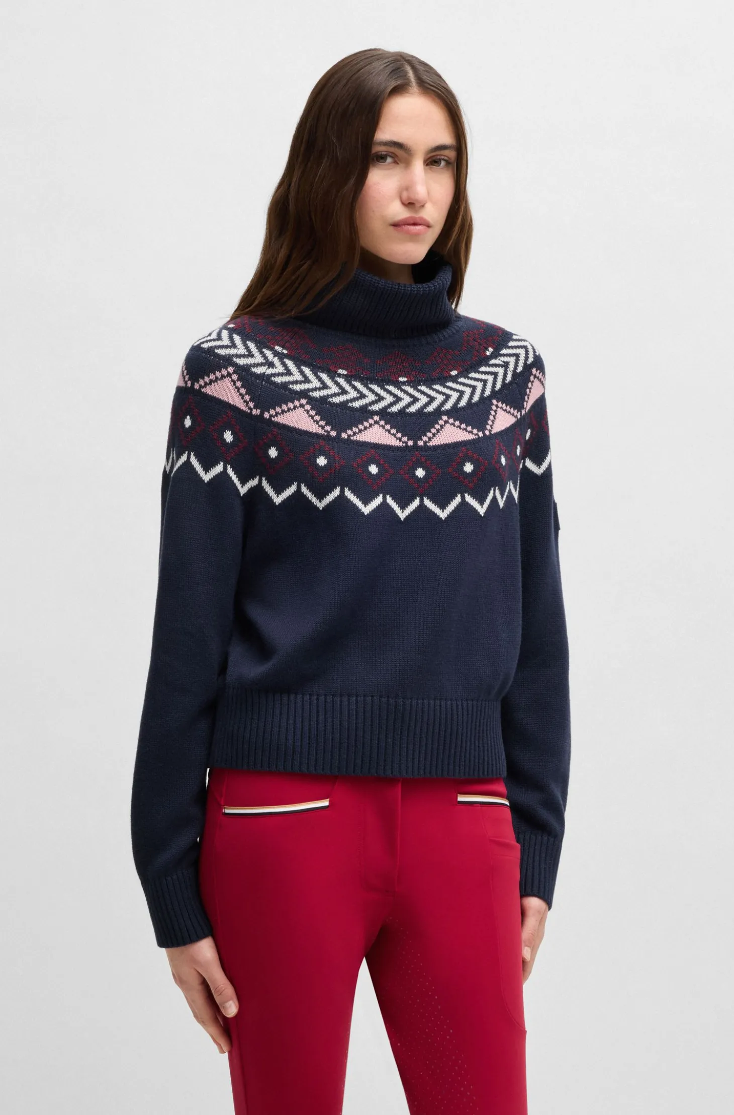 Equestrian rollneck sweater with knitted pattern