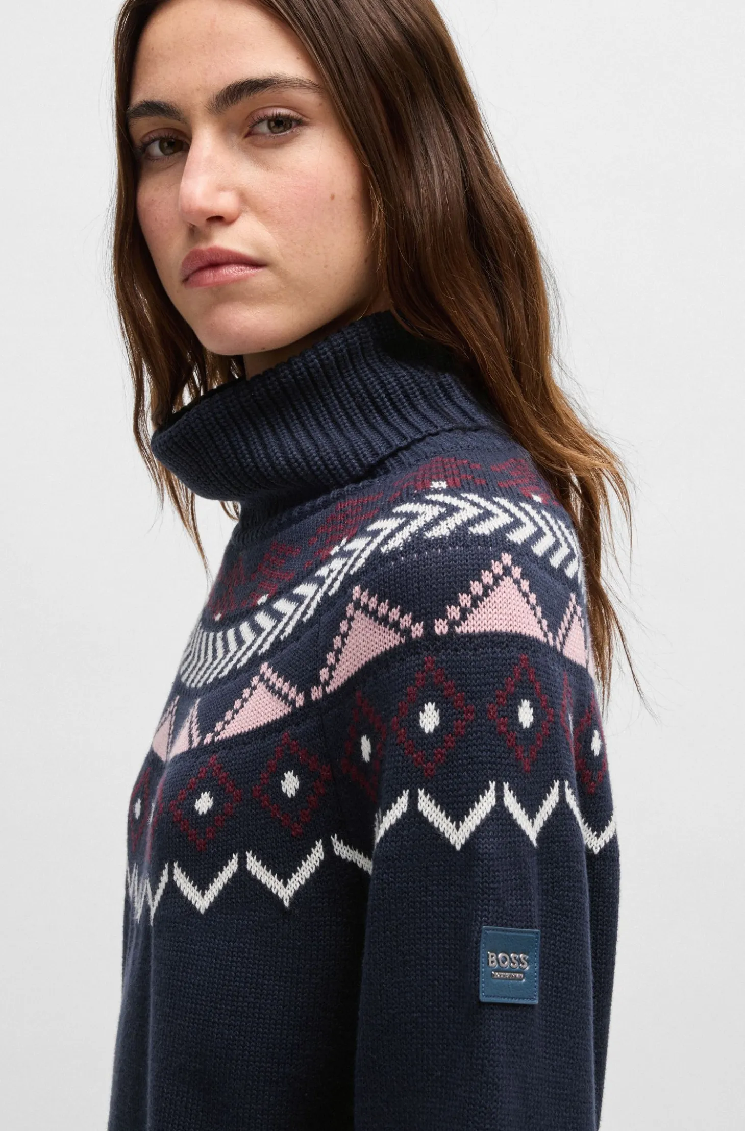 Equestrian rollneck sweater with knitted pattern