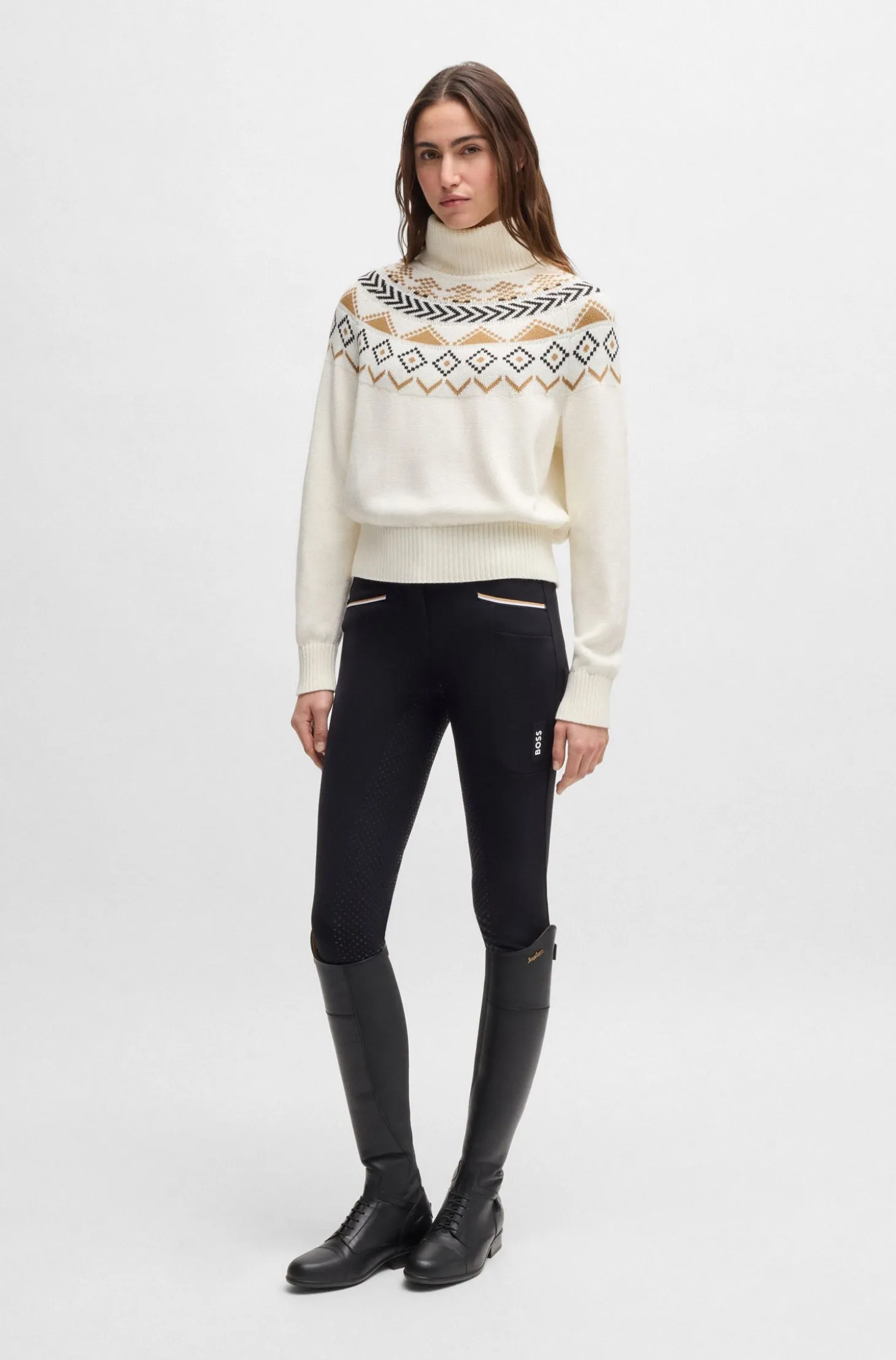 Equestrian rollneck sweater with knitted pattern