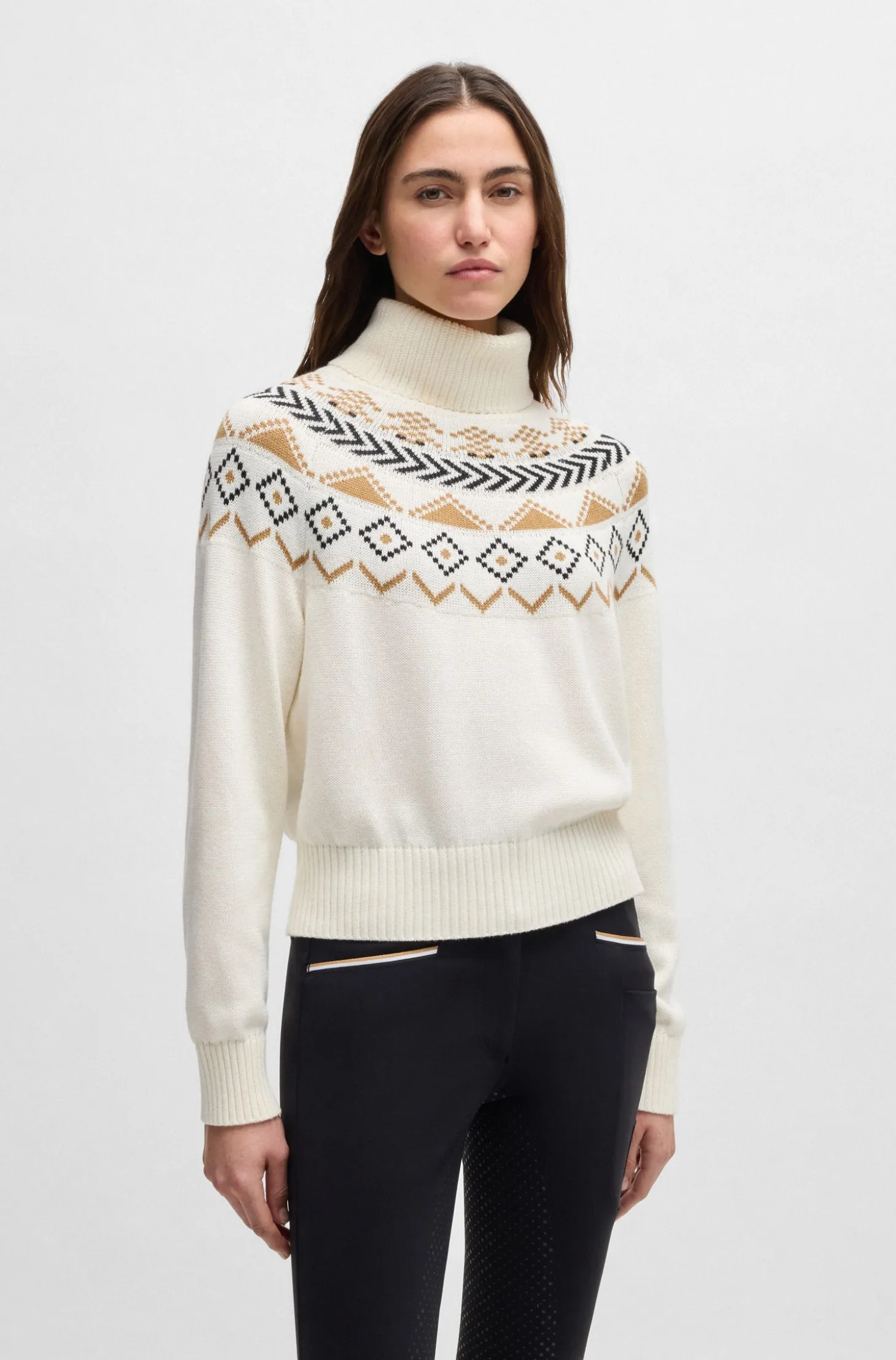 Equestrian rollneck sweater with knitted pattern