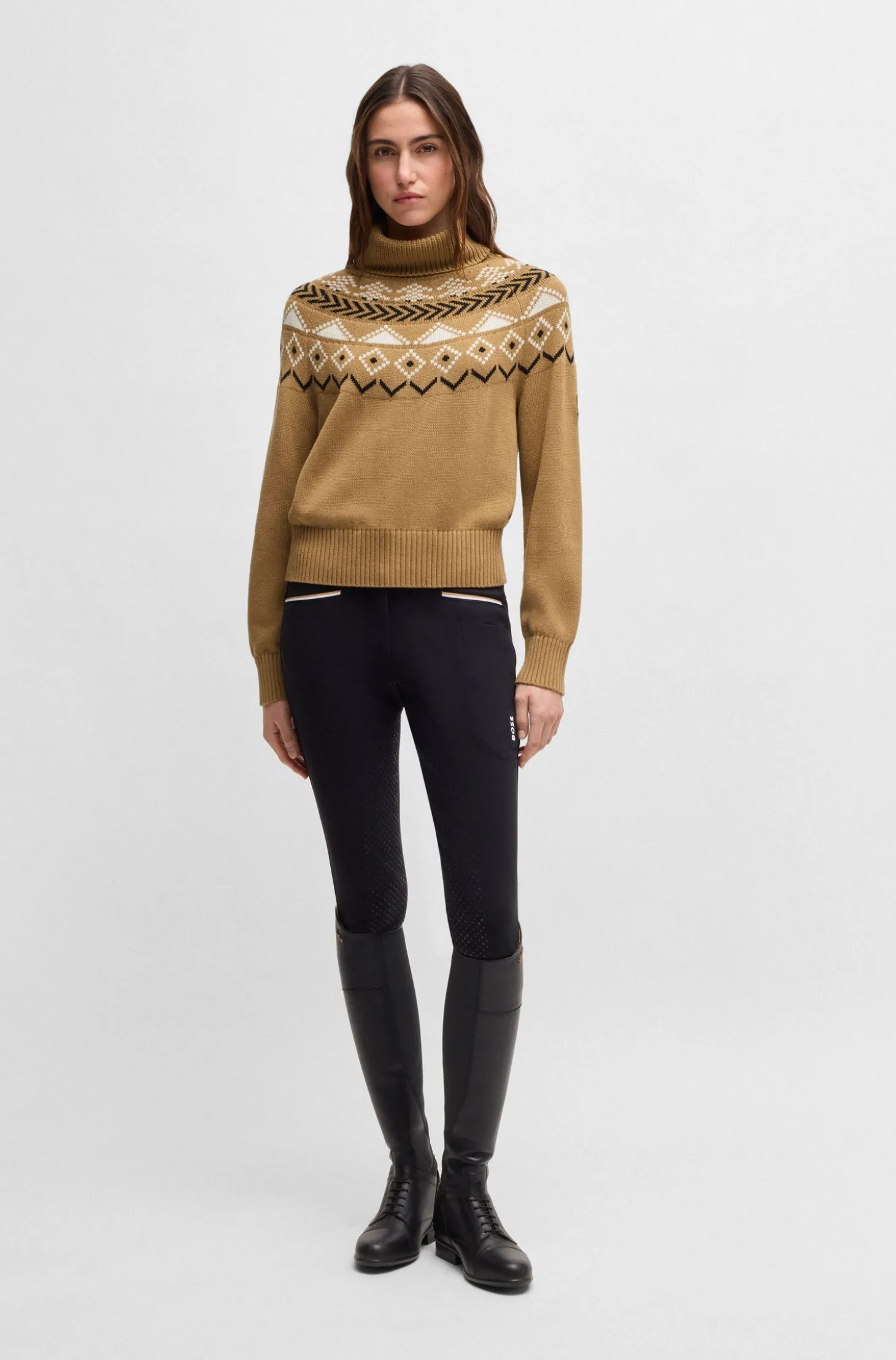 Equestrian rollneck sweater with knitted pattern