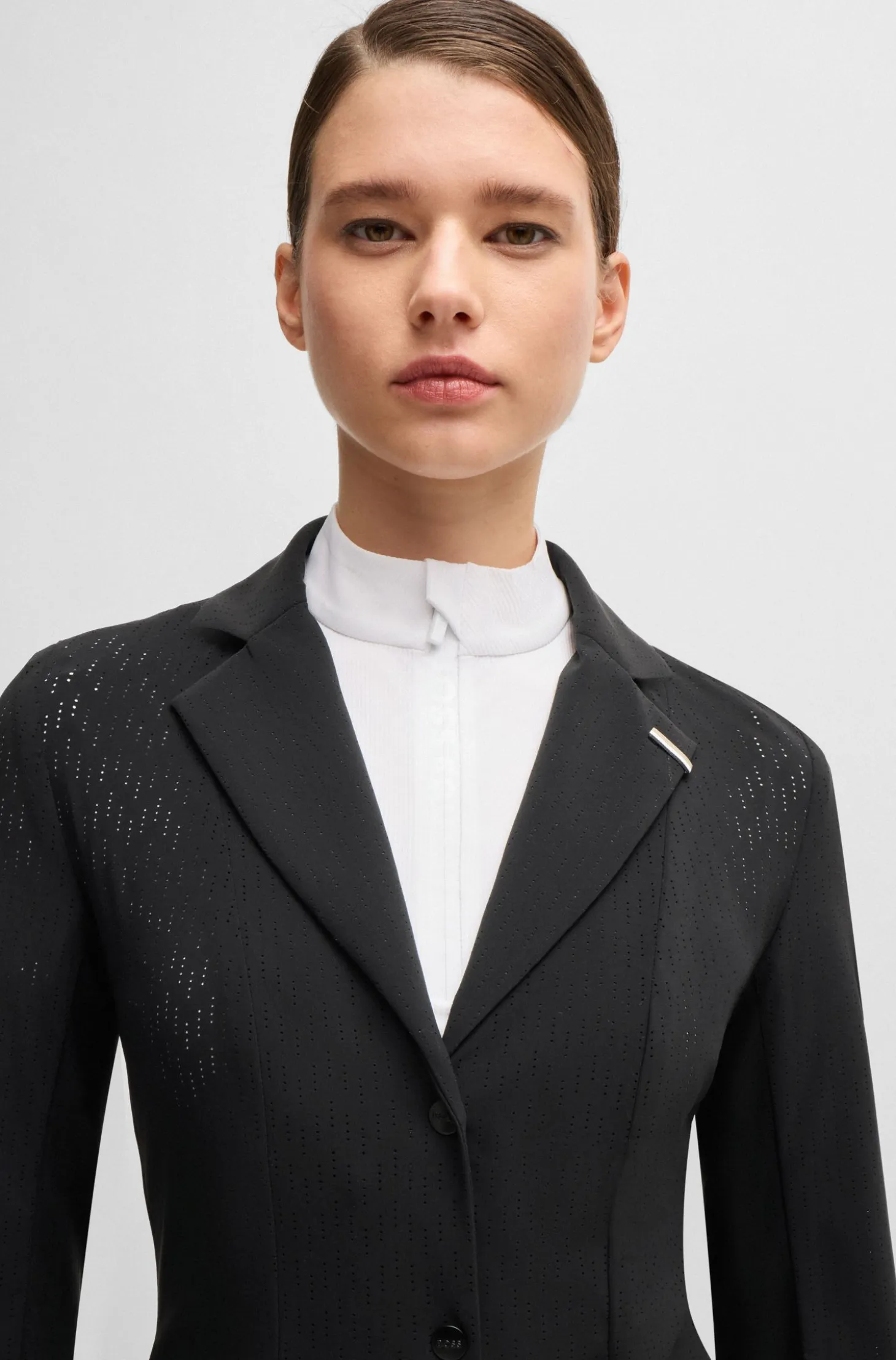 Equestrian show jacket in perforated material