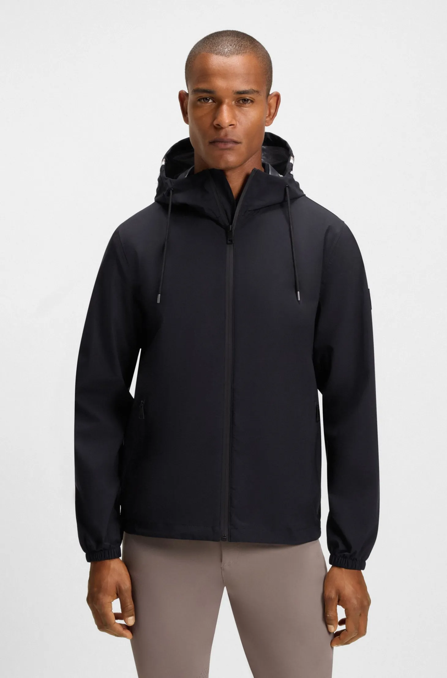 Equestrian waterproof jacket with adjustable hood